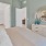 a bedroom with a bed and lamps