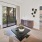a living room with a sliding glass door to private patio