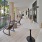 rocking chairs and side tables along covered breezeway